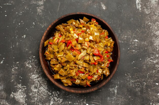 Top close-up view appetizing dish appetizing dish of green beans on the dark table