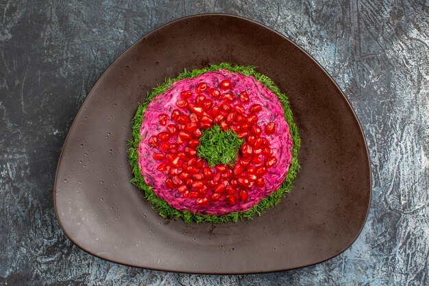 Top close-up view dish an appetizing dish with herbs pomegranate seeds