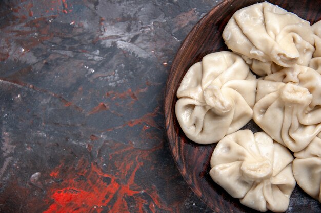 Top close-up view khinkali brown bowl of the appetizing khinkali