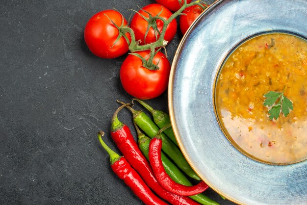 Top close-up view lentil soup lentil soup hot peppers tomatoes with pedicels