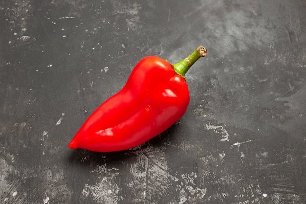 Top close-up view peppers red bell pepper on the dark table