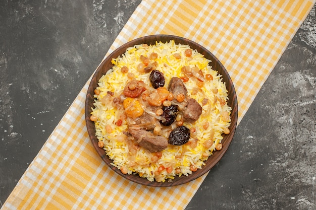 Top close-up view pilaf an appetizing pilaf on the checkered tablecloth