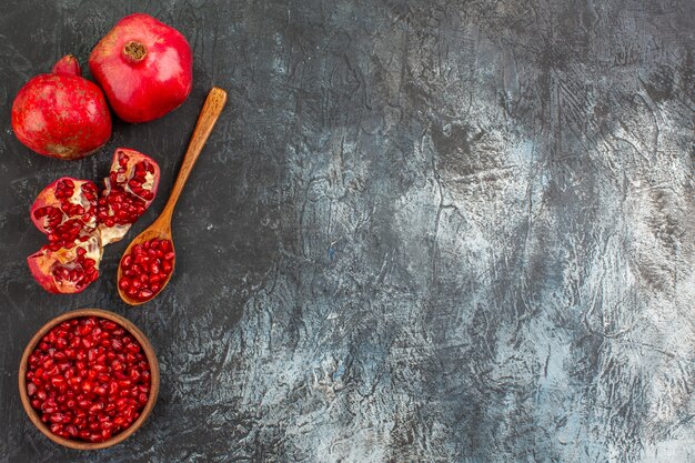 Top close-up view pomegranate spoon pomegranate pomegranate seeds