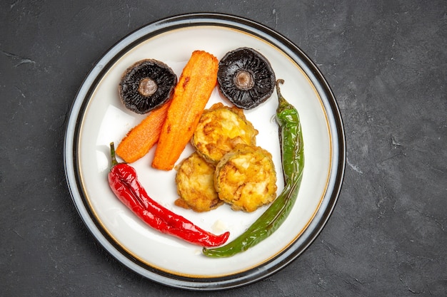 Top close-up view roasted vegetables the appetizing roasted vegetables on the plate