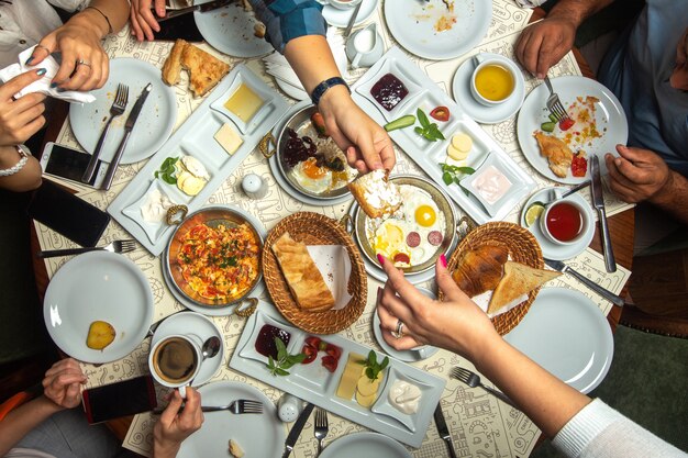 A top close up view table breakfast time family having with different meals