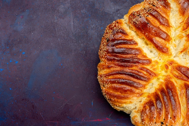 Free photo top close view delicious pastry baked bun on dark background.