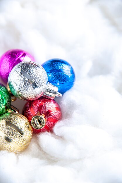 Top close view mini xmas balls on white background