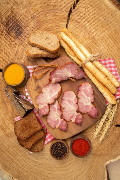 Top distant view becon slices on chopping board