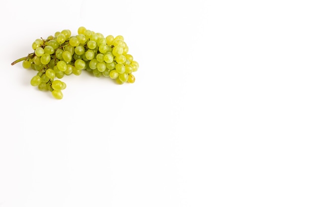 Top distant view fresh juicy grapes mellow and ed on the white background
