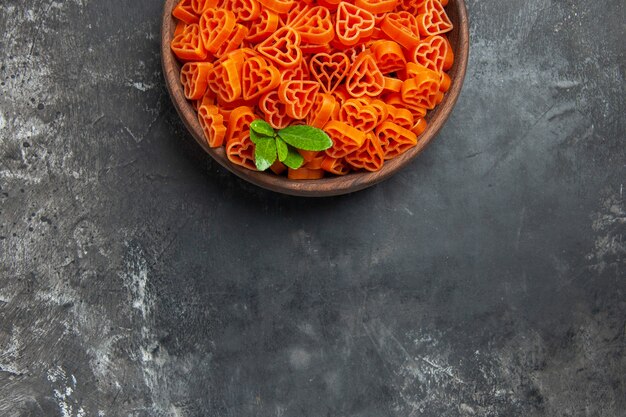 Top half view heart shaped red italian pasta