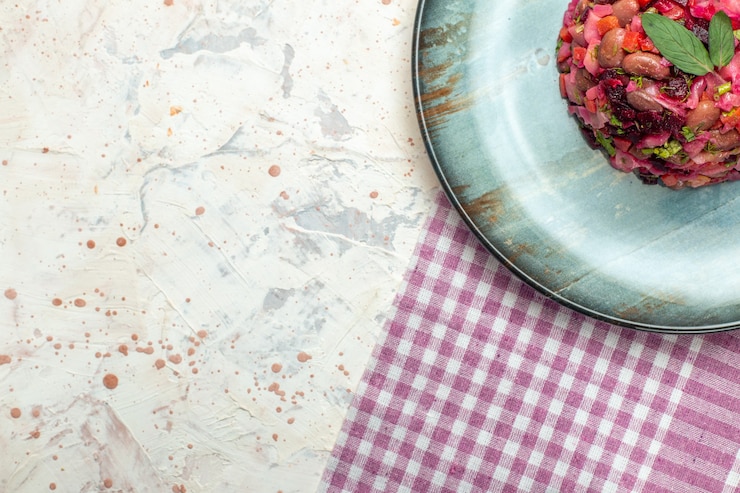 Free Photo top half view vinaigrette salad on oval plate
