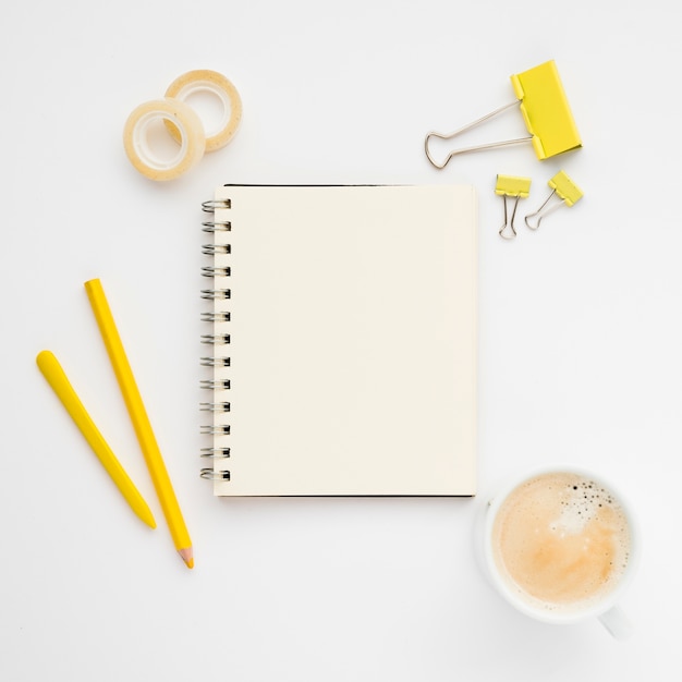 Top lay of neat desk with notebook