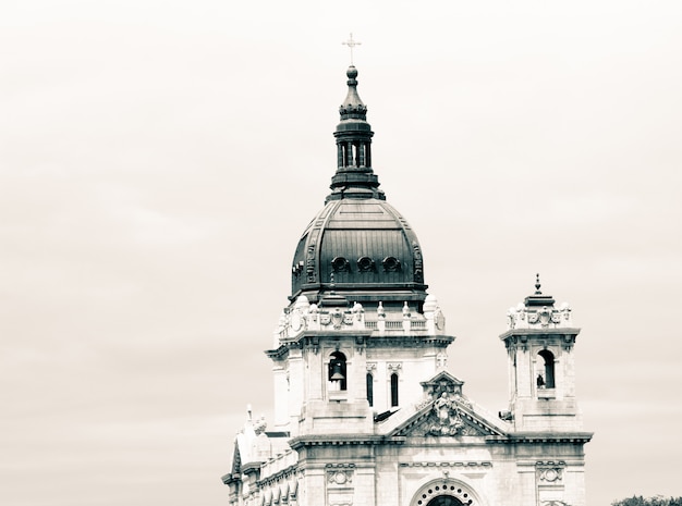 Top of an old Christian church with amazing architecture and white sky