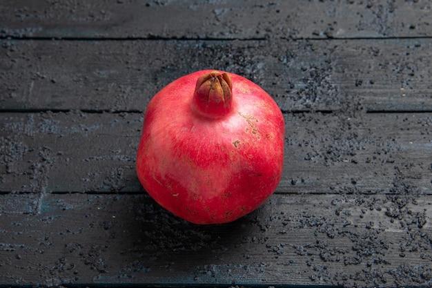 Top side view ripe pomegranate ripe pomegranate on dark surface