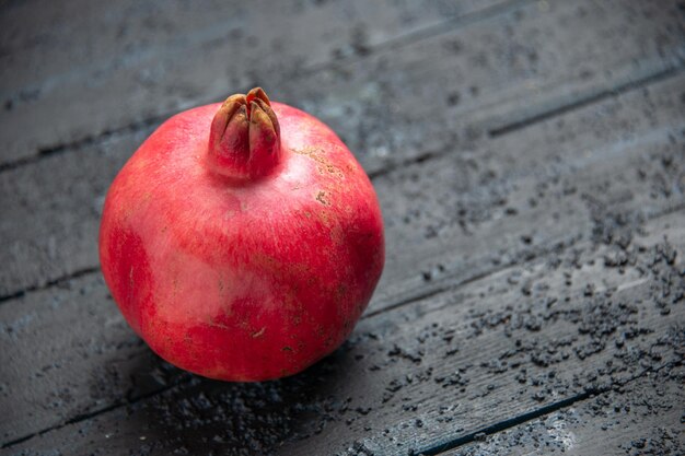 Top side view ripe pomegranate ripe pomegranate on wooden table