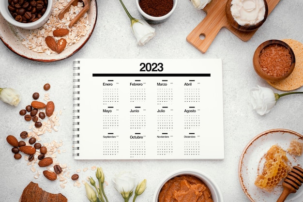 Top view 2023 calendar with coffee cups