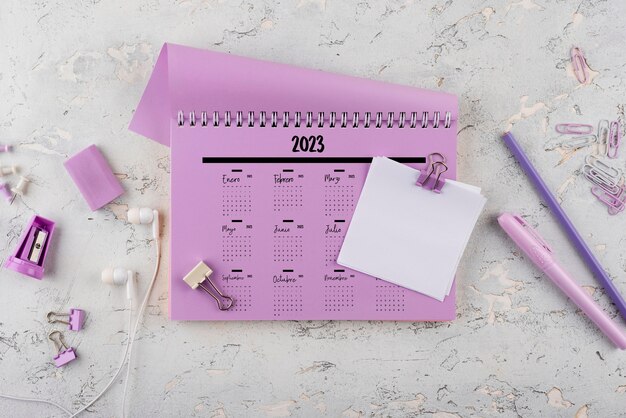 Top view 2023 calendar with desk items