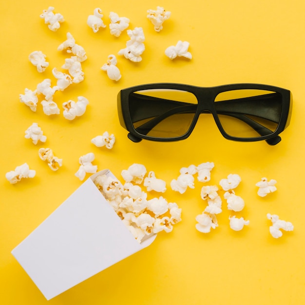 Free photo top view 3d glasses with tasty popcorn