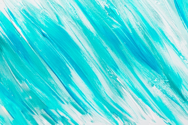 Top view of abstract blue paint brush strokes on surface