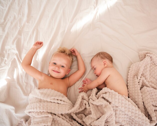 Top view of adorable siblings indoors
