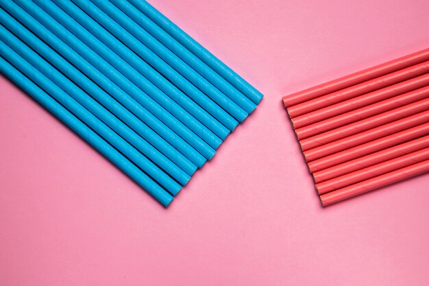 Top view aligned plastic blue and red straws