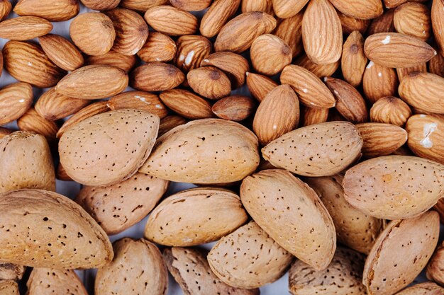 Top view of almond nuts on white background