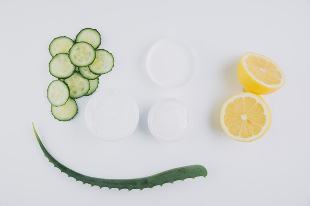 Top view aloe vera with beauty tools and cosmetics