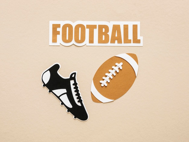 Top view of american football and sneaker