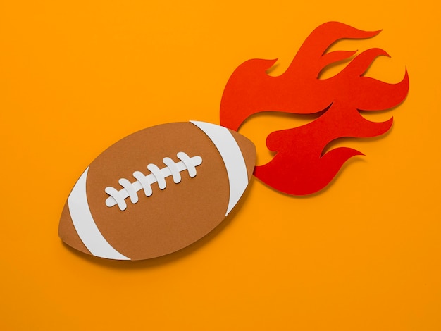 Top view of american football with flame