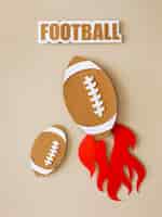Free photo top view of american footballs with flame