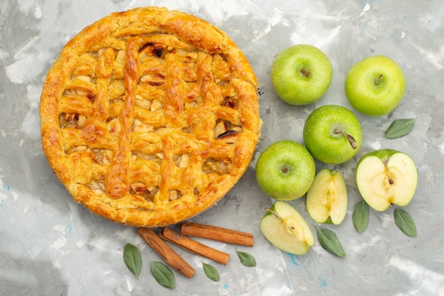 A top view apple cake round formed delicious with fresh apples flour on the white background cake biscuit