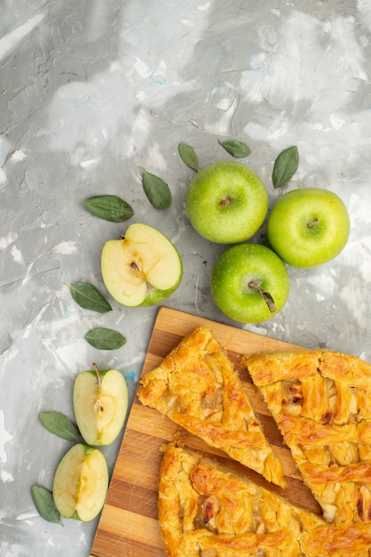 A top view apple cake round formed delicious with fresh apples on the white desk cake biscuit