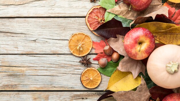 Top view of apple with dried citrus and squash