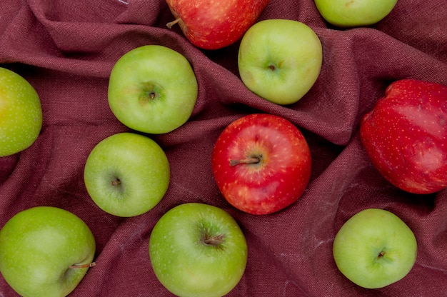 Top view  of apples on bordo cloth