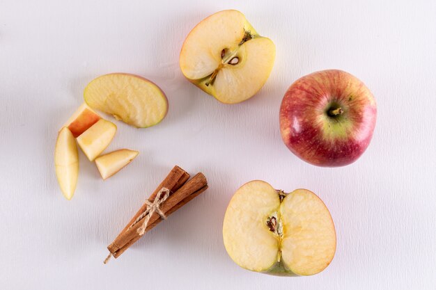 Top view apples half sliced with cinnamon