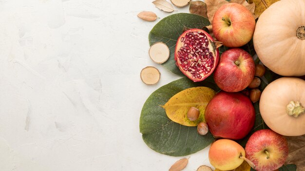 Top view of apples with autumn leaves and copy space