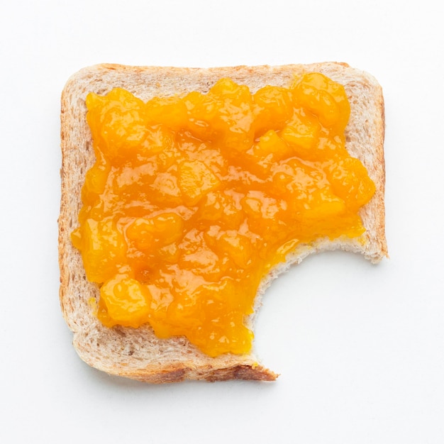 Top view apricots jam on bread