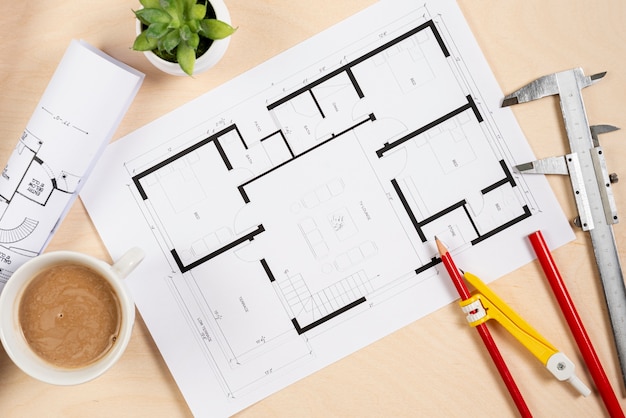 Top view architectural plan on desk