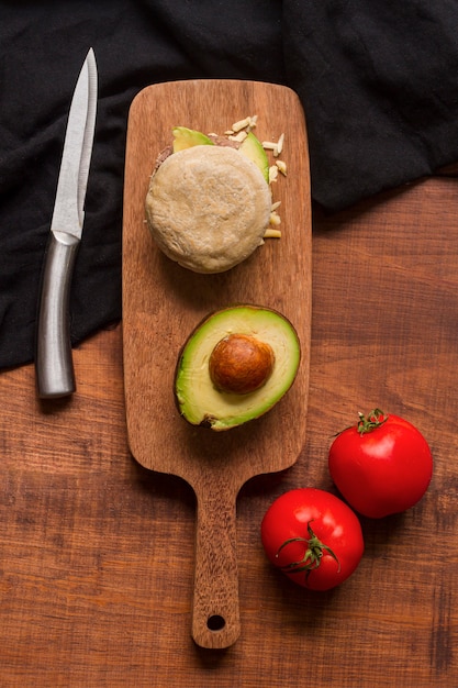 Top view of arepa with avocado and tomatoes