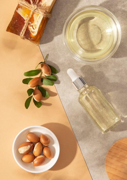 Free photo top view arrangement of argan oil care product