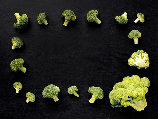 Top view arrangement of delicious fresh broccoli with copy space