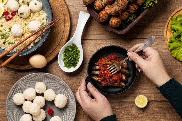 Free photo top view arrangement of delicious indonesian bakso