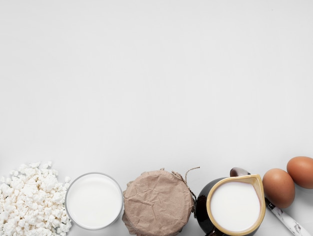 Top view arrangement of different ingredients on white background with copy space