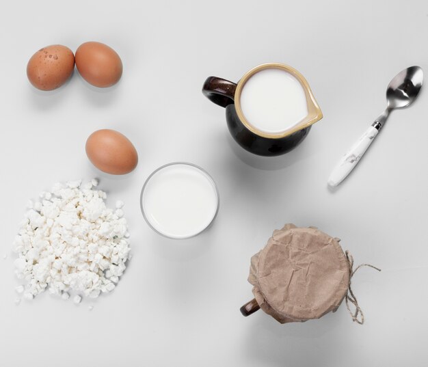 Top view arrangement of different ingredients on white background