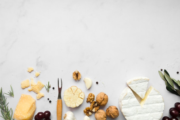 Top view arrangement of different types of cheese with copy space