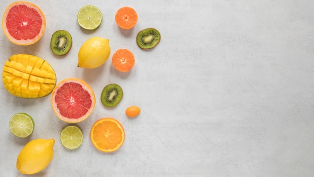 Free photo top view arrangement of exotic fruits on the table