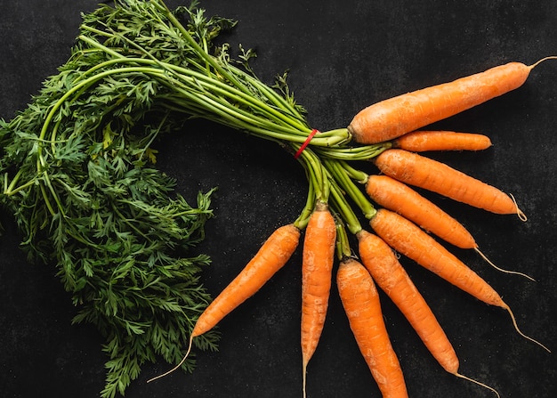 Top view arrangement of fresh carrots