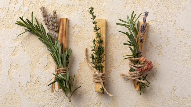 Top view arrangement of leaves and wooden sticks