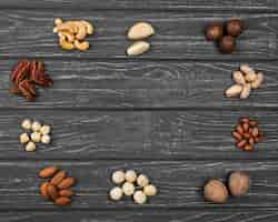 Free photo top view arrangement of organic nuts copy space