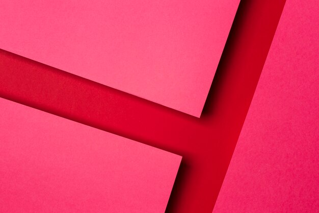 Top view arrangement of red paper sheets background